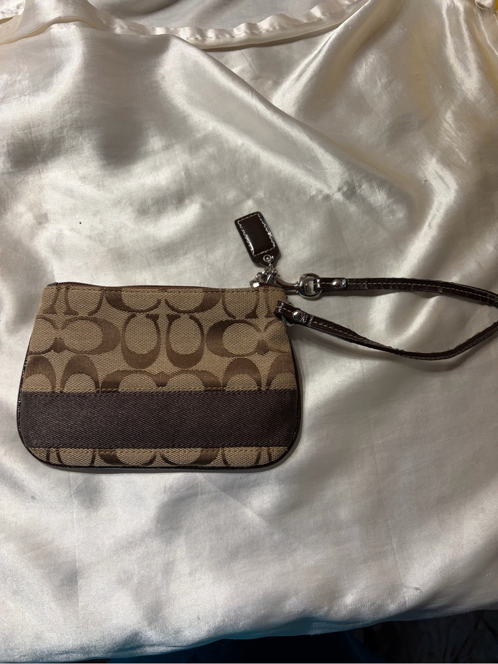 Coach brown and tan wristlet